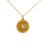 Gold necklace with lucky charm medal and stone