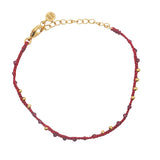 Bracelet doré cordon bordeaux grenat et perles dorées