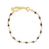 Golden bracelet with small natural stones