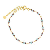 Golden bracelet with small natural stones