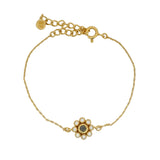 Gold bracelet with flower, stone and zircons