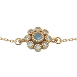 Gold bracelet with flower, stone and zircons