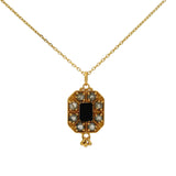 Gold necklace with stone plaque and gold tassels