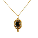 Gold necklace with stone plaque and gold tassels