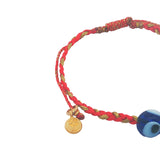 Bracelet sur cordon rouge avec oeil bleu en verre soufflé