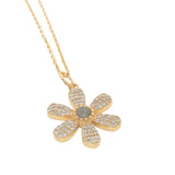 Gold necklace with flower pendant, stone and zircons