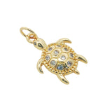 Charms doré tortue en zircons blancs