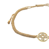 Bracelet cordon doré médaille ajourée dorée avec trèfle en zircons
