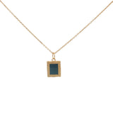 Gold necklace with textured pendant and rectangular stone