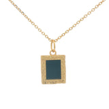 Gold necklace with textured pendant and rectangular stone