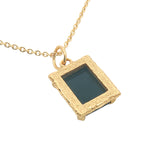 Gold necklace with textured pendant and rectangular stone