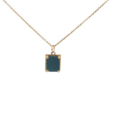Gold necklace with textured pendant and rectangular stone
