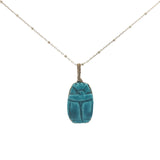 Collier doré scarabée en céramique teintée en bleu turquoise 60 cm