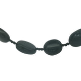 Collier doré perles ovales en onyx noire et noeuds noirs 75 cm