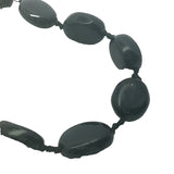 Collier doré perles ovales en onyx noire et noeuds noirs 75 cm