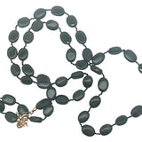 Collier doré perles ovales en onyx noire et noeuds noirs 75 cm