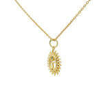 Collier doré scarabée avec un zircon blanc