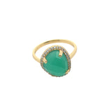 Golden ring with faceted stone and zircons