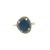 Golden ring with faceted stone and zircons