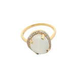 Golden ring with faceted stone and zircons