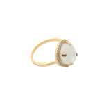 Golden ring with faceted stone and zircons
