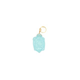 Charms doré tortue taillée dans de la topaze bleue