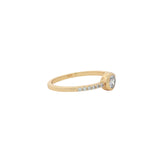 Golden ring with round stone and zircons