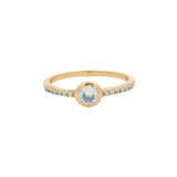 Golden ring with round stone and zircons