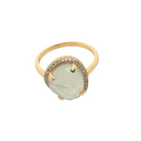 Golden ring with faceted stone and zircons