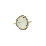 Golden ring with faceted stone and zircons