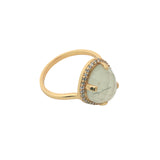 Golden ring with faceted stone and zircons