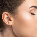 Gold ear jewel with double chain and zircons