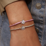 Two-tone braided bracelet and silver clover