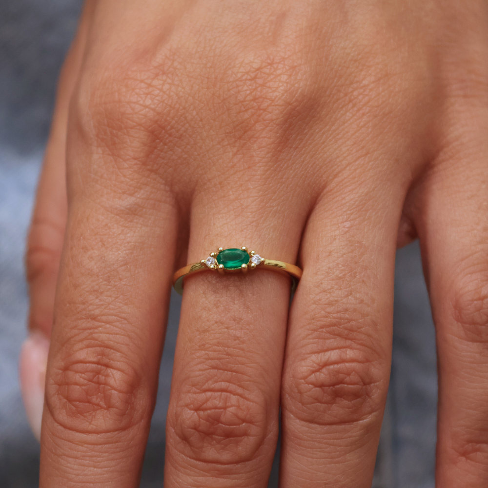 Golden ring with stone and two zircons