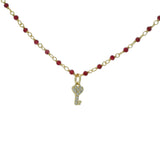 Ras de cou doré rubis indien et clés zircons 38cm