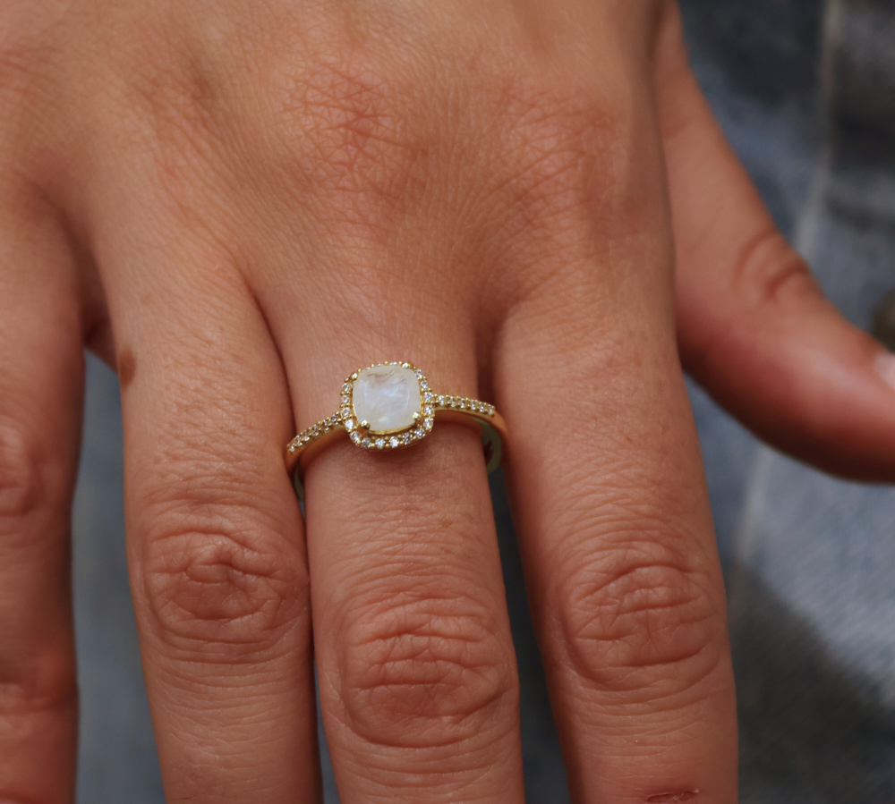 Golden solitaire ring with zircons and square stone