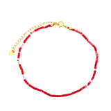 Chaine de cheville dorée et perles rouges et blanches