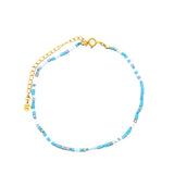 Chaine de cheville dorée en perles bleues et blanches