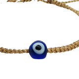 Gold braided cord bracelet with blown glass eye