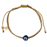 Gold braided cord bracelet with blown glass eye