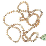 Collier doré disques de coquillage et scarabée vert 68 cm