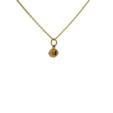 Gold necklace with hammered eye medal and stone