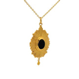 Gold necklace with rays and cabochon stone