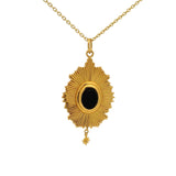 Gold necklace with rays and cabochon stone