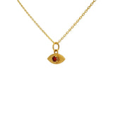 Gold necklace with hammered eye medal and stone