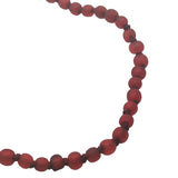 Collier doré petites perles rouges avec noeuds rouges 75 cm