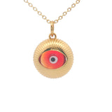 Gold necklace with heart and burgundy glass eye