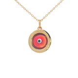 Gold necklace with heart and burgundy glass eye
