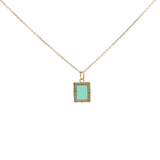 Gold necklace with textured pendant and rectangular stone