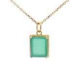 Gold necklace with textured pendant and rectangular stone
